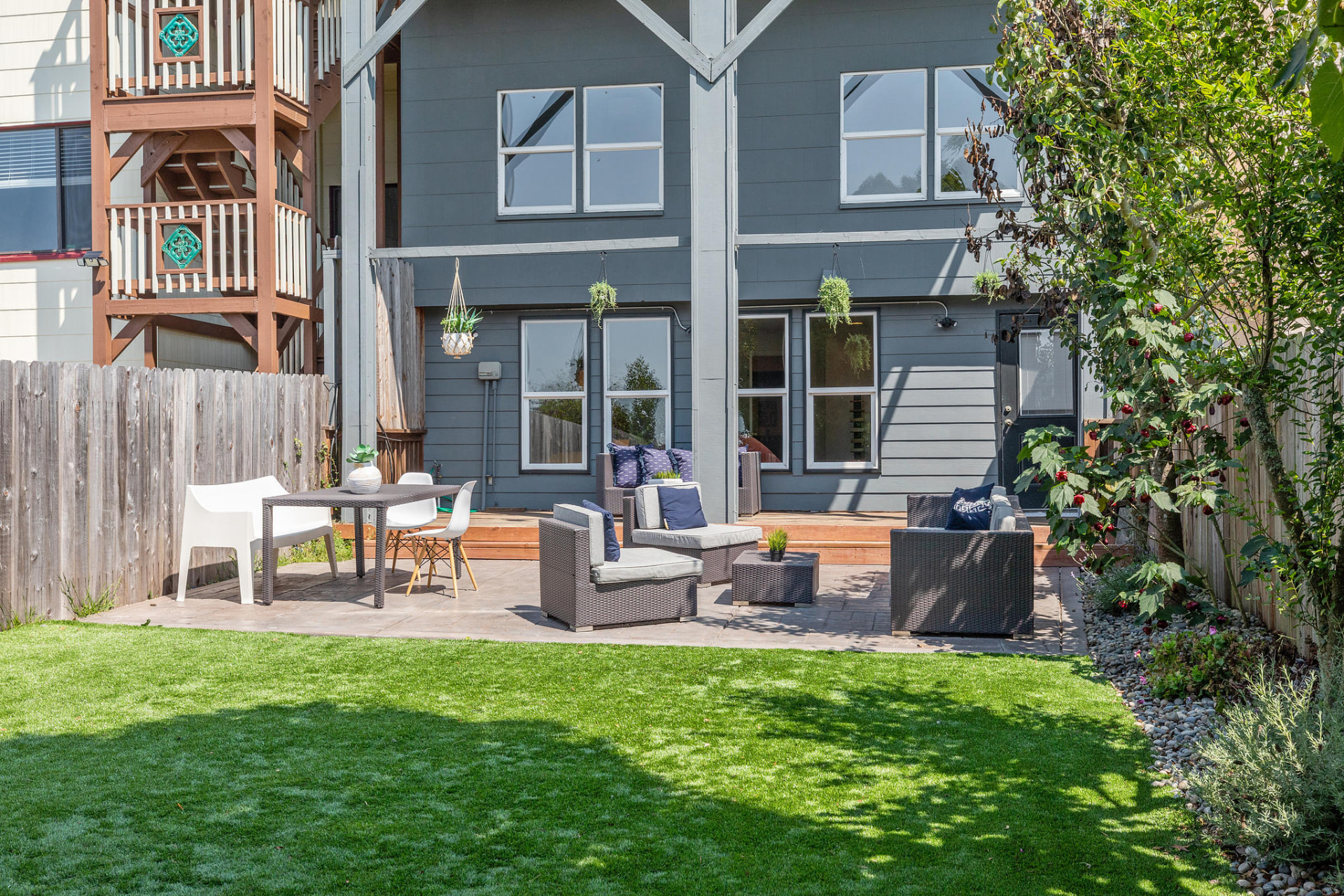 Landscaped backyard patio with outdoor seating