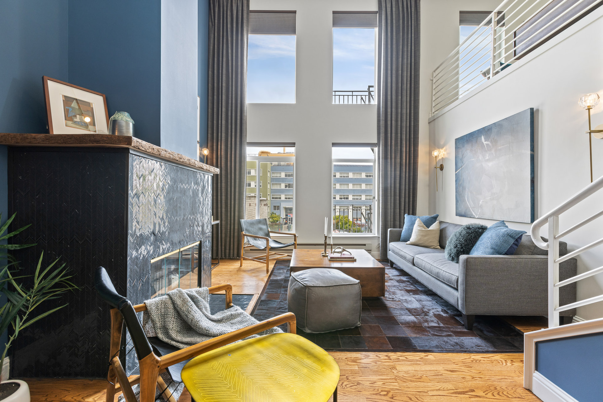 Sunlit loft living room with high ceilings