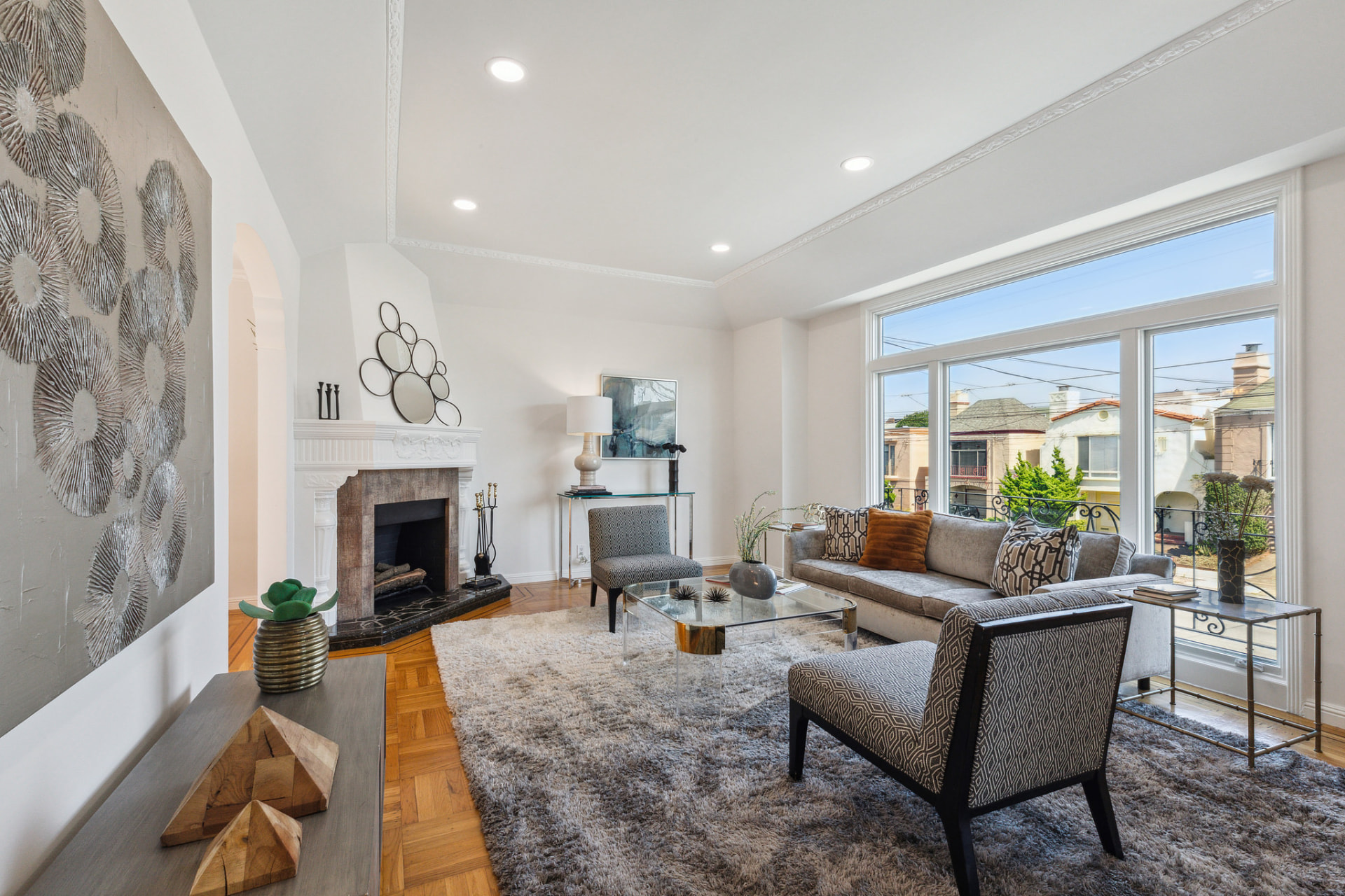 Bright modern living room with fireplace and sliding glass doors